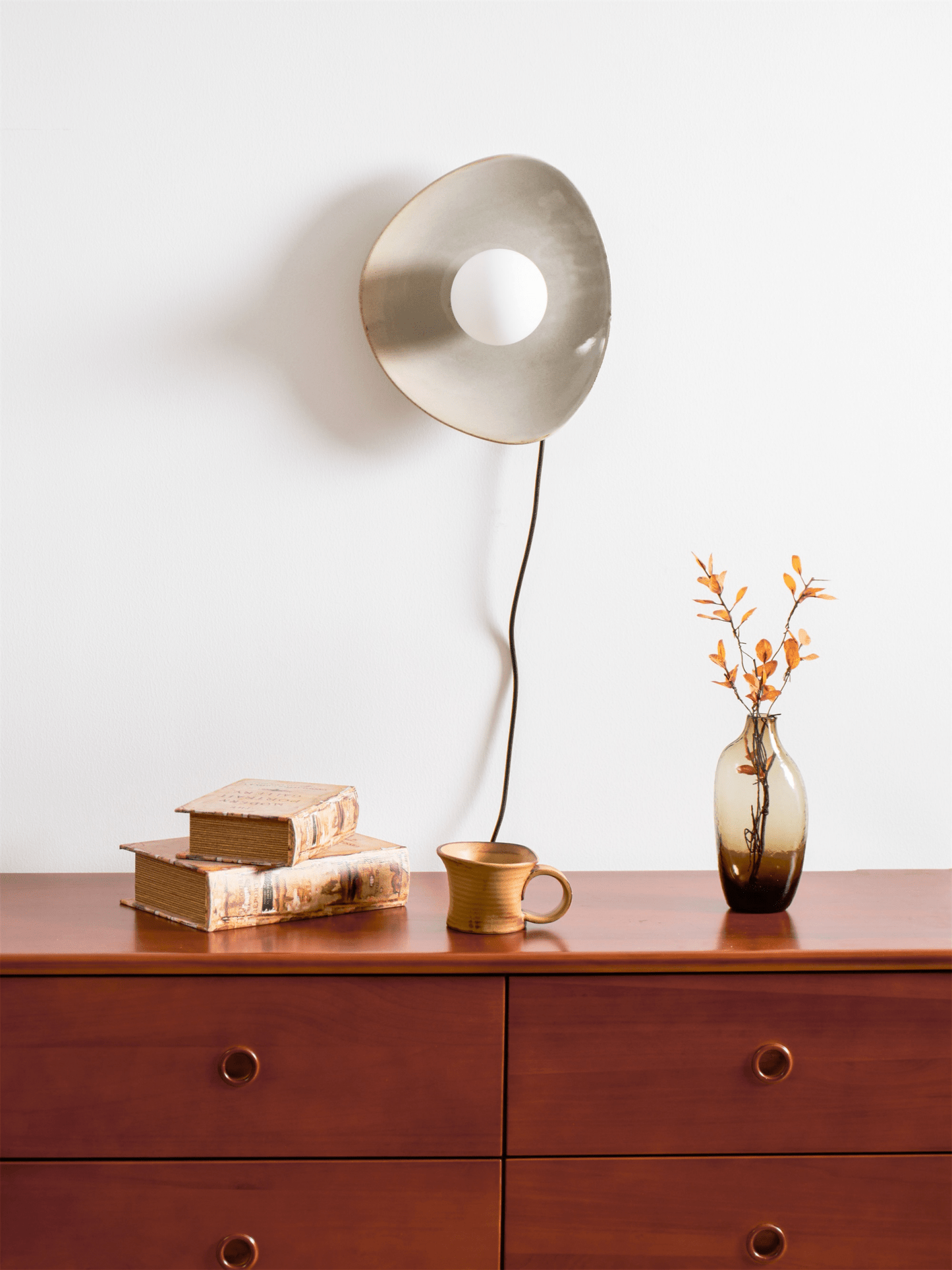Pebble Disc Plug-in Wall Light with Adjustable Brightness & Energy Eff