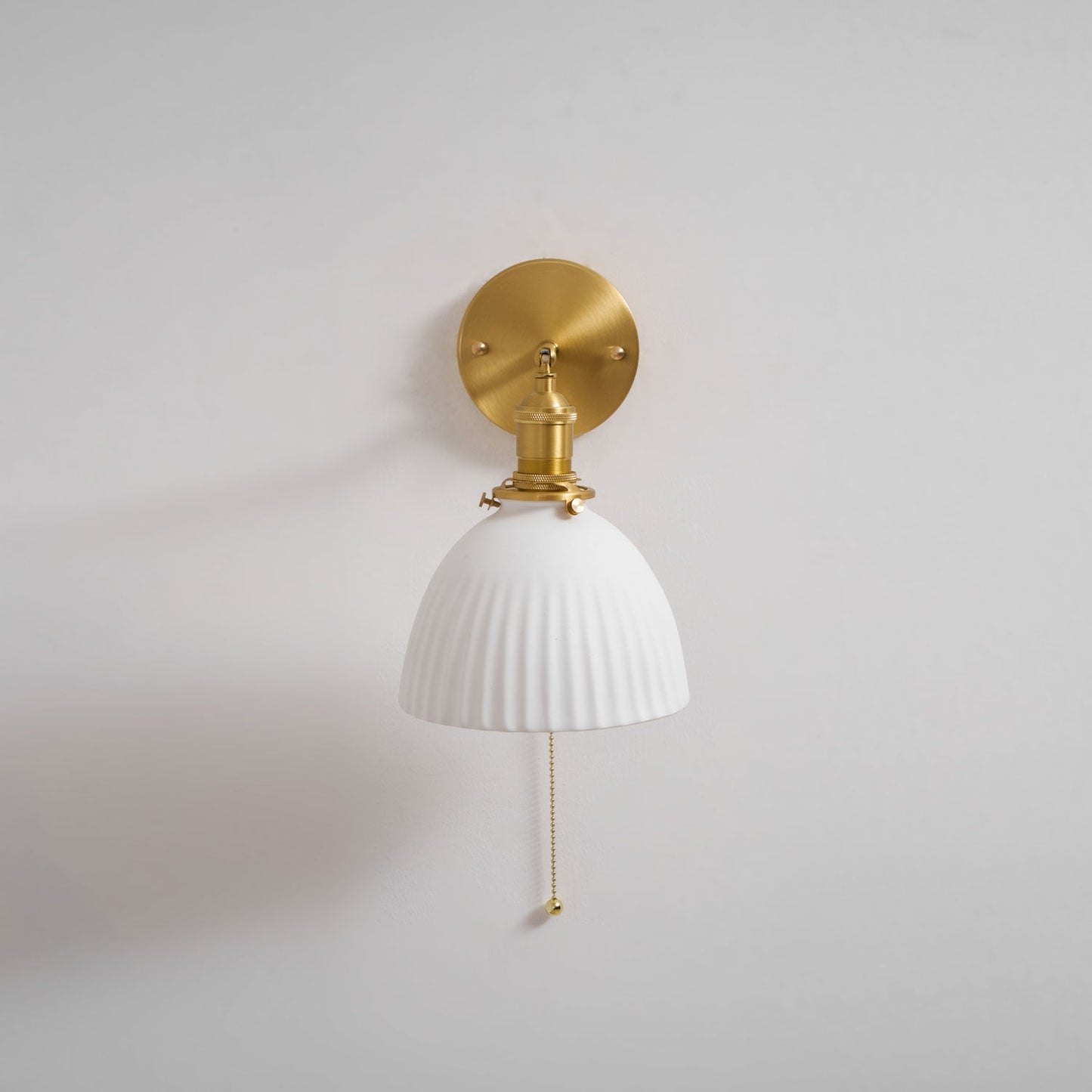 Brass Pleated Ceramic Wall Lamp - Elegant Design with Adjustable Light