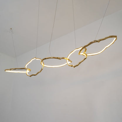 Elegant Brass Chandelier with Adjustable Arms and Ambient Lighting
