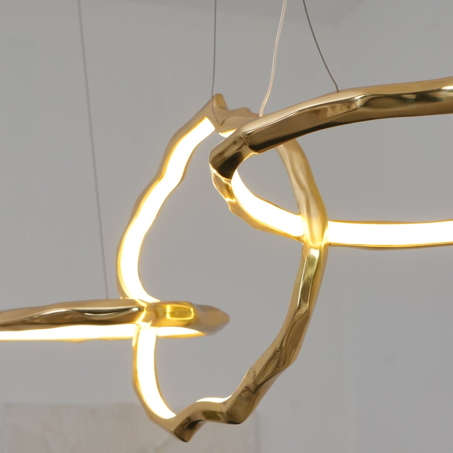 Elegant Brass Chandelier with Adjustable Arms and Ambient Lighting