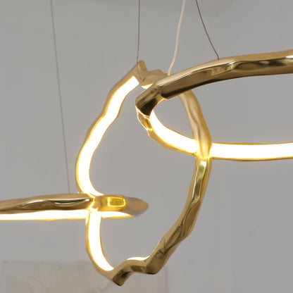 Elegant Brass Chandelier with Adjustable Arms and Ambient Lighting