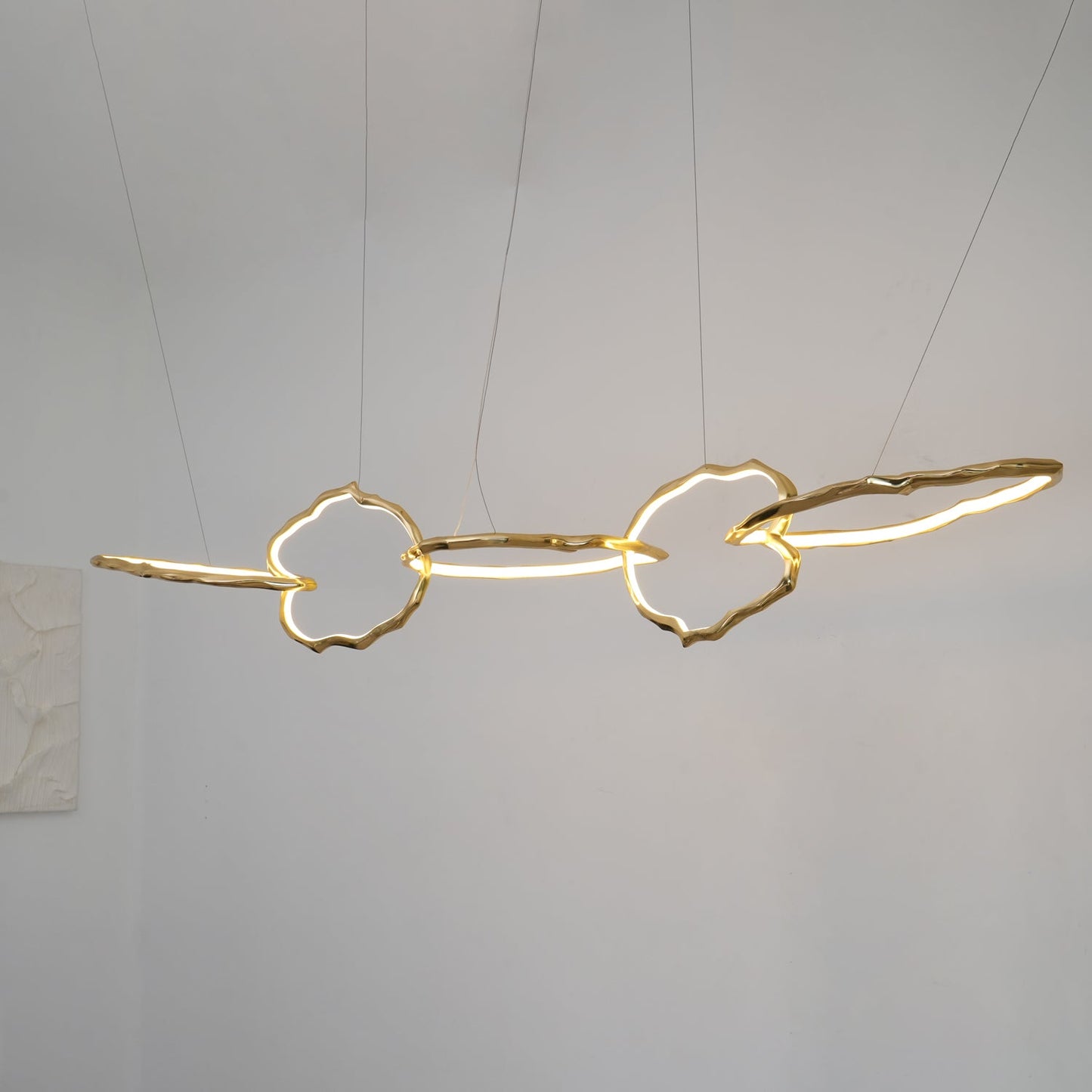 Elegant Brass Chandelier with Adjustable Arms and Ambient Lighting