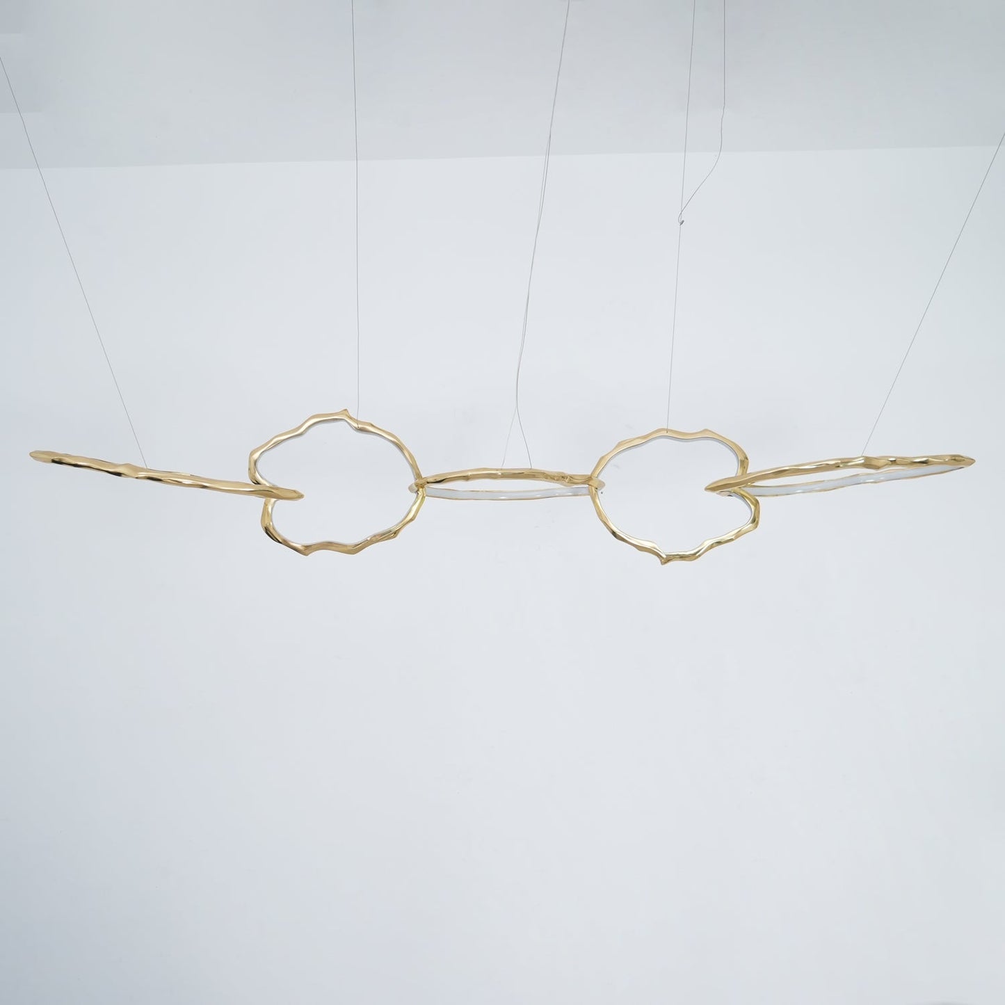 Elegant Brass Chandelier with Adjustable Arms and Ambient Lighting
