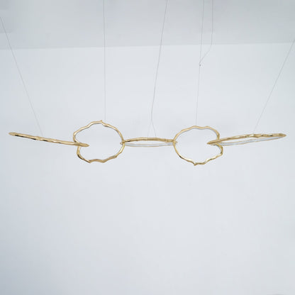 Elegant Brass Chandelier with Adjustable Arms and Ambient Lighting