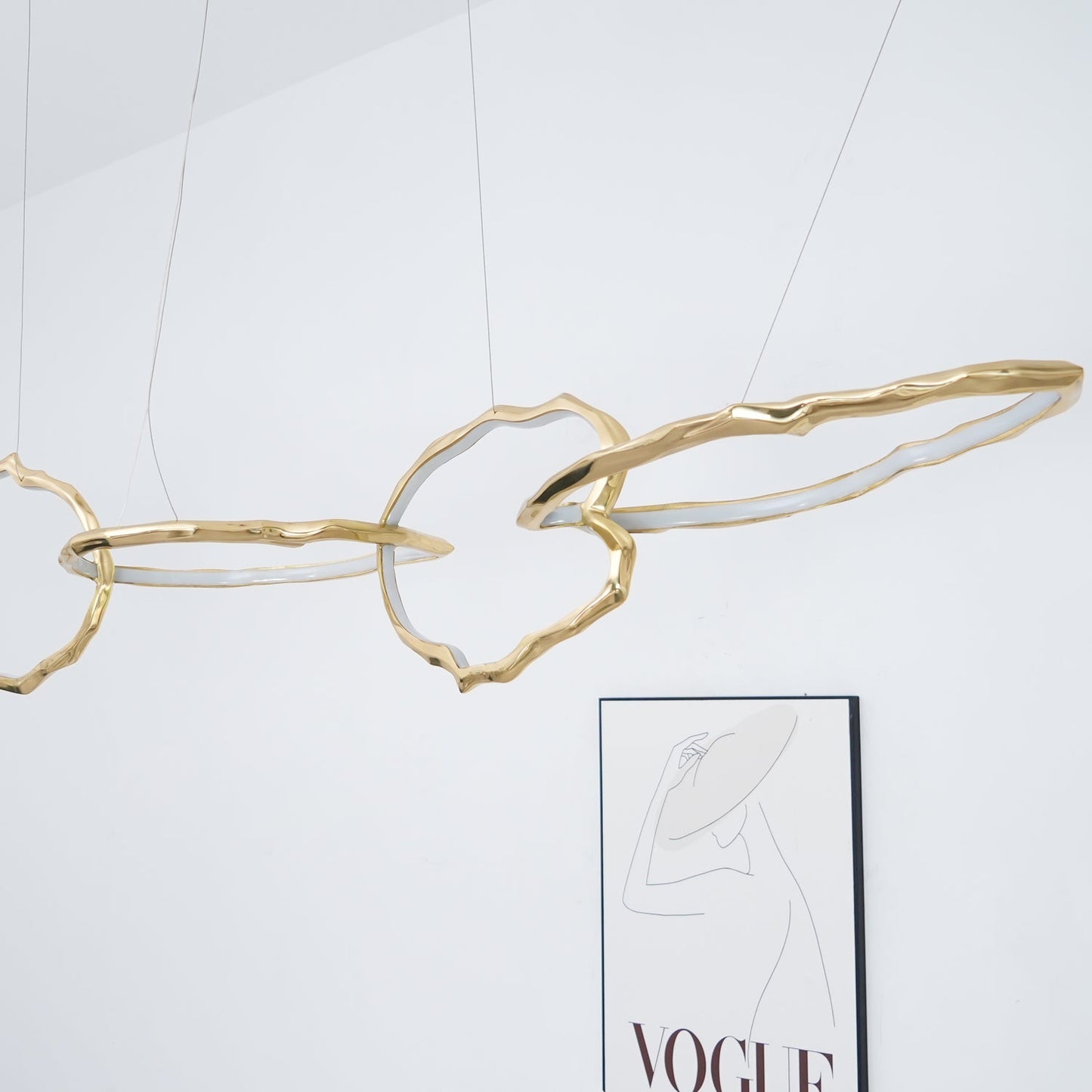 Elegant Brass Chandelier with Adjustable Arms and Ambient Lighting
