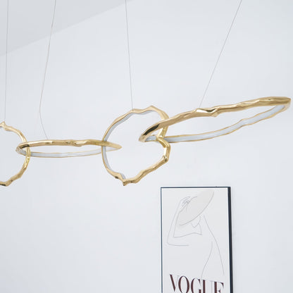 Elegant Brass Chandelier with Adjustable Arms and Ambient Lighting