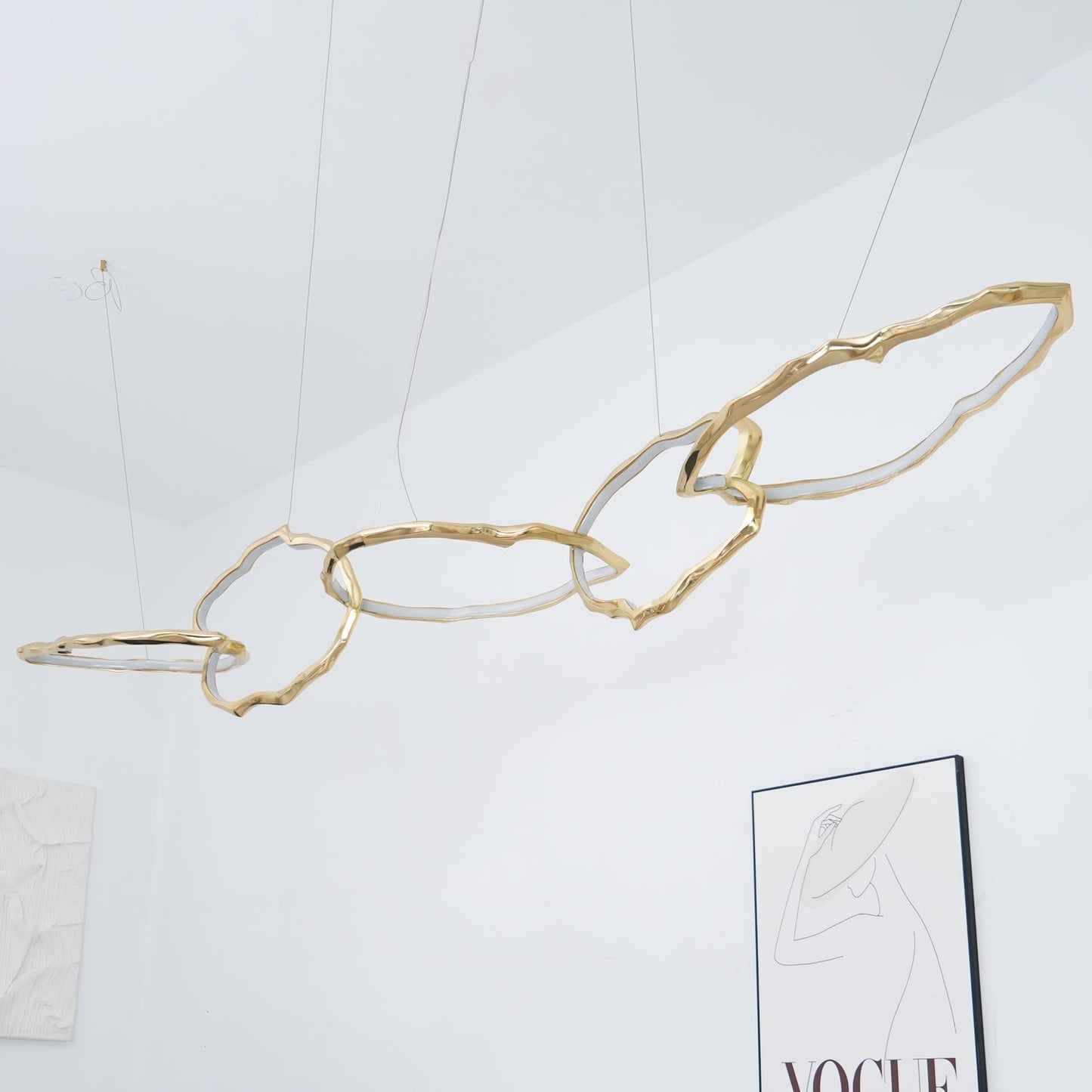 Elegant Brass Chandelier with Adjustable Arms and Ambient Lighting