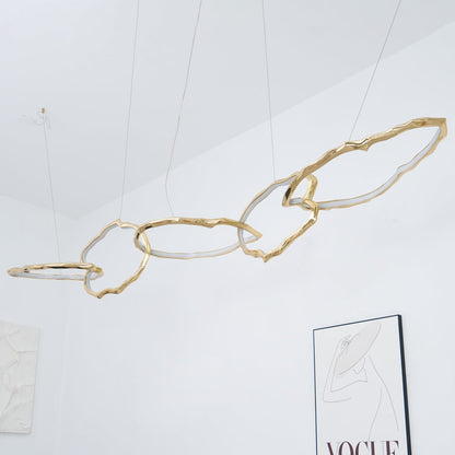 Elegant Brass Chandelier with Adjustable Arms and Ambient Lighting