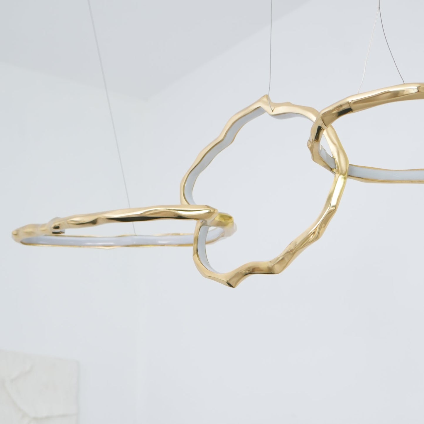 Elegant Brass Chandelier with Adjustable Arms and Ambient Lighting