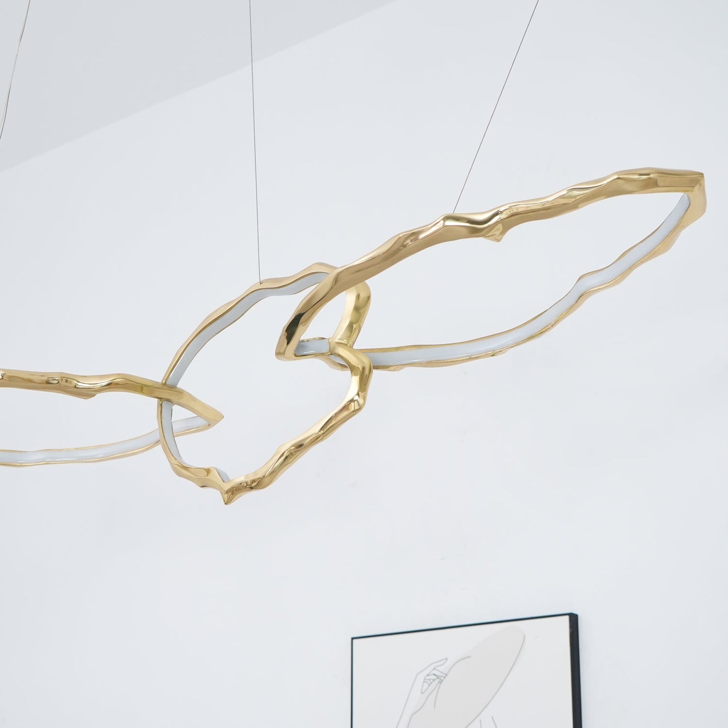 Elegant Brass Chandelier with Adjustable Arms and Ambient Lighting
