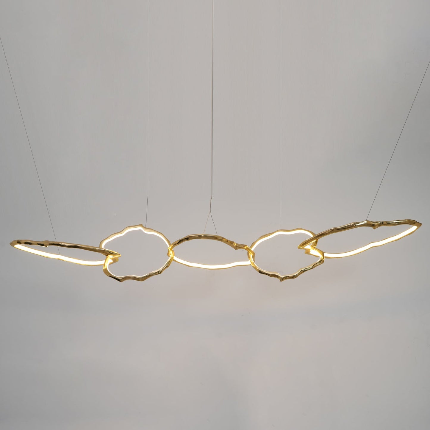 Elegant Brass Chandelier with Adjustable Arms and Ambient Lighting