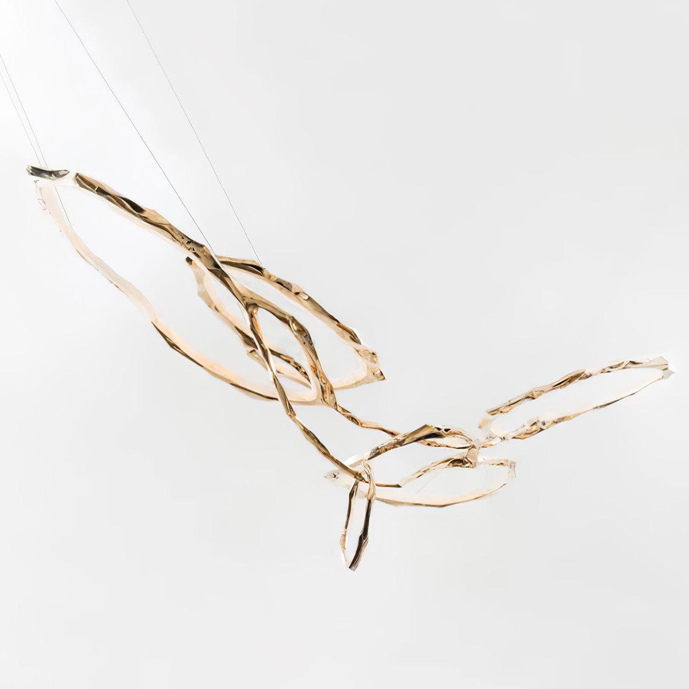 Elegant Brass Chandelier with Adjustable Arms and Ambient Lighting