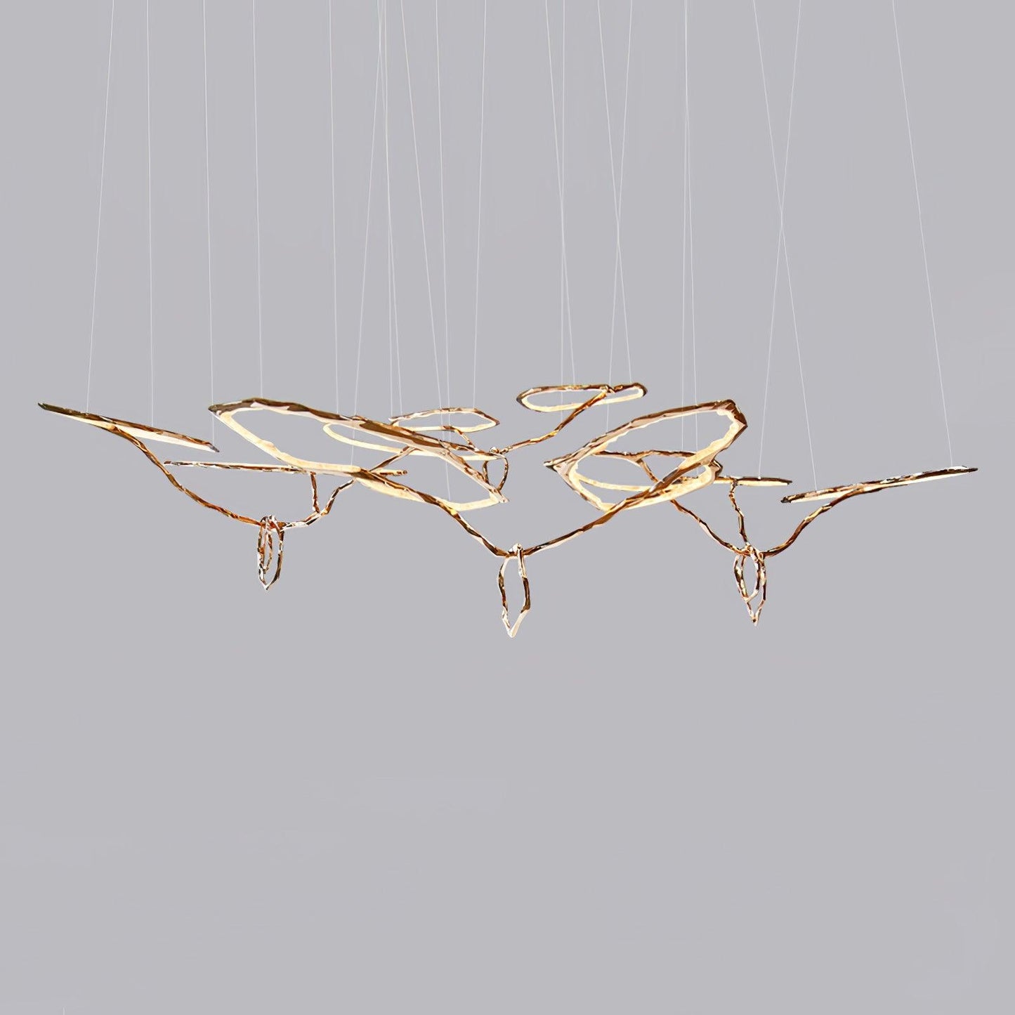 Elegant Brass Chandelier with Adjustable Arms and Ambient Lighting