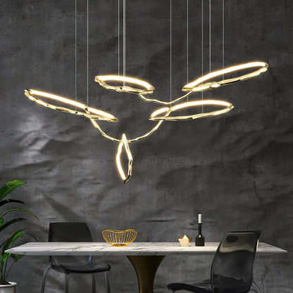 Elegant Brass Chandelier with Adjustable Arms and Ambient Lighting
