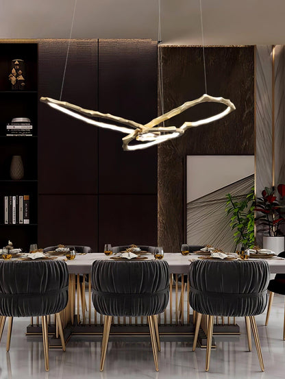 Elegant Brass Chandelier with Adjustable Arms and Ambient Lighting