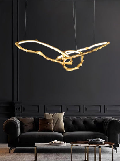 Elegant Brass Chandelier with Adjustable Arms and Ambient Lighting