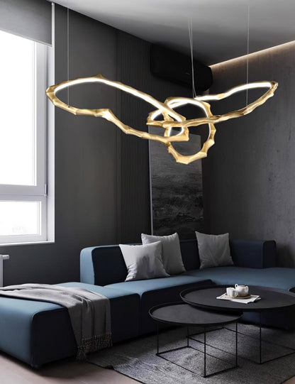 Elegant Brass Chandelier with Adjustable Arms and Ambient Lighting