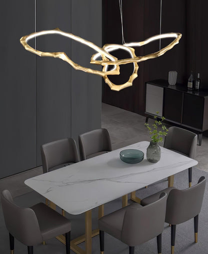 Elegant Brass Chandelier with Adjustable Arms and Ambient Lighting