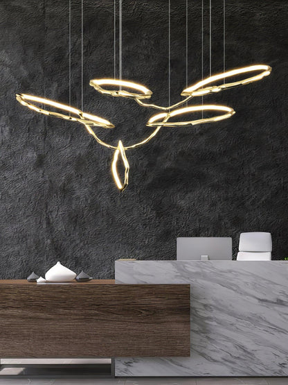 Elegant Brass Chandelier with Adjustable Arms and Ambient Lighting