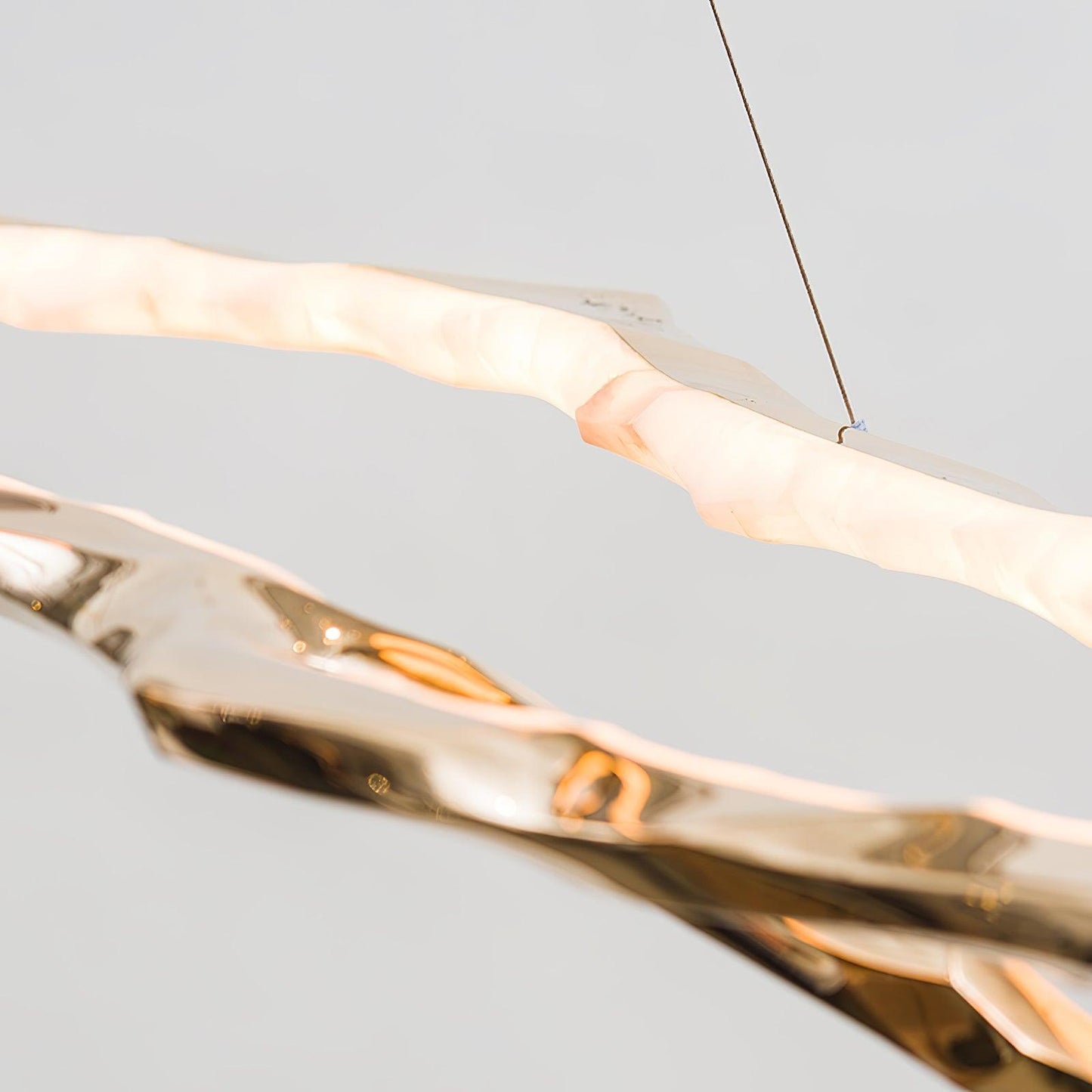 Elegant Brass Chandelier with Adjustable Arms and Ambient Lighting