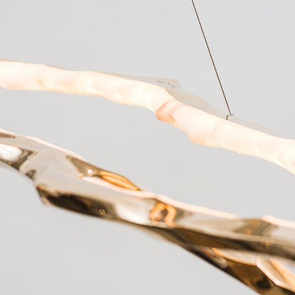 Elegant Brass Chandelier with Adjustable Arms and Ambient Lighting