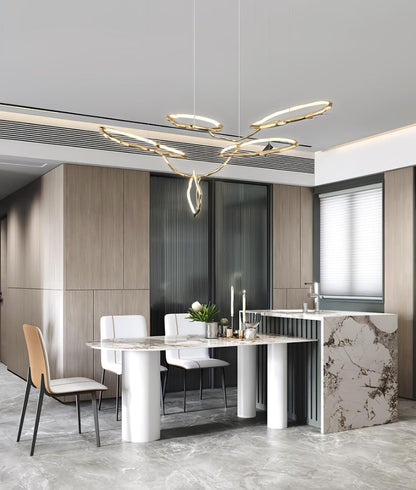 Elegant Brass Chandelier with Adjustable Arms and Ambient Lighting
