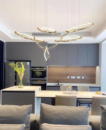 Elegant Brass Chandelier with Adjustable Arms and Ambient Lighting