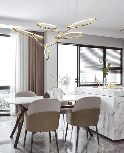 Elegant Brass Chandelier with Adjustable Arms and Ambient Lighting