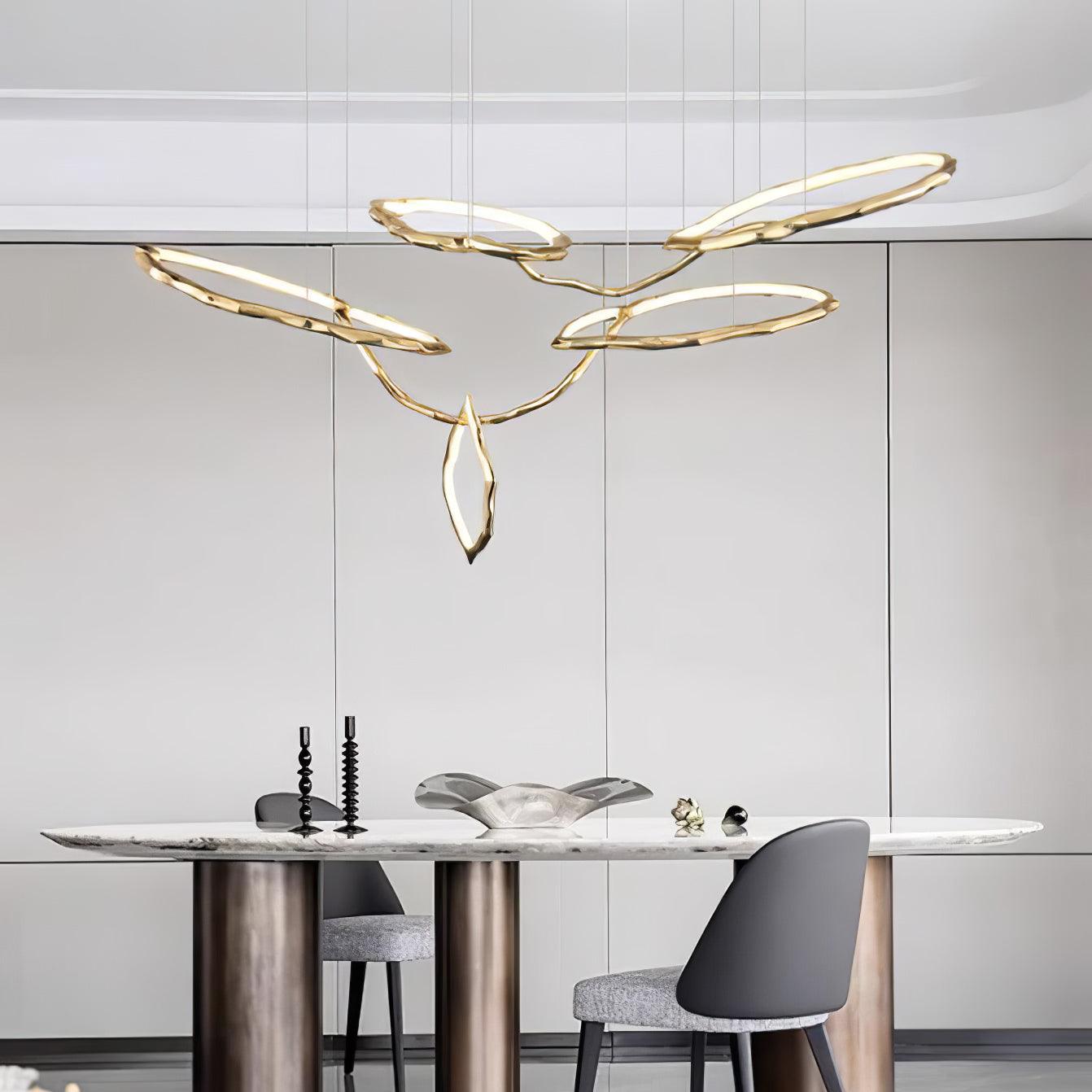 Elegant Brass Chandelier with Adjustable Arms and Ambient Lighting