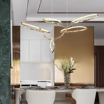 Elegant Brass Chandelier with Adjustable Arms and Ambient Lighting
