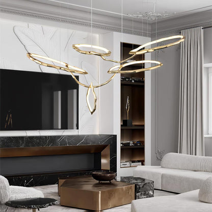 Elegant Brass Chandelier with Adjustable Arms and Ambient Lighting