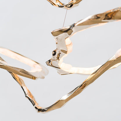 Elegant Brass Chandelier with Adjustable Arms and Ambient Lighting