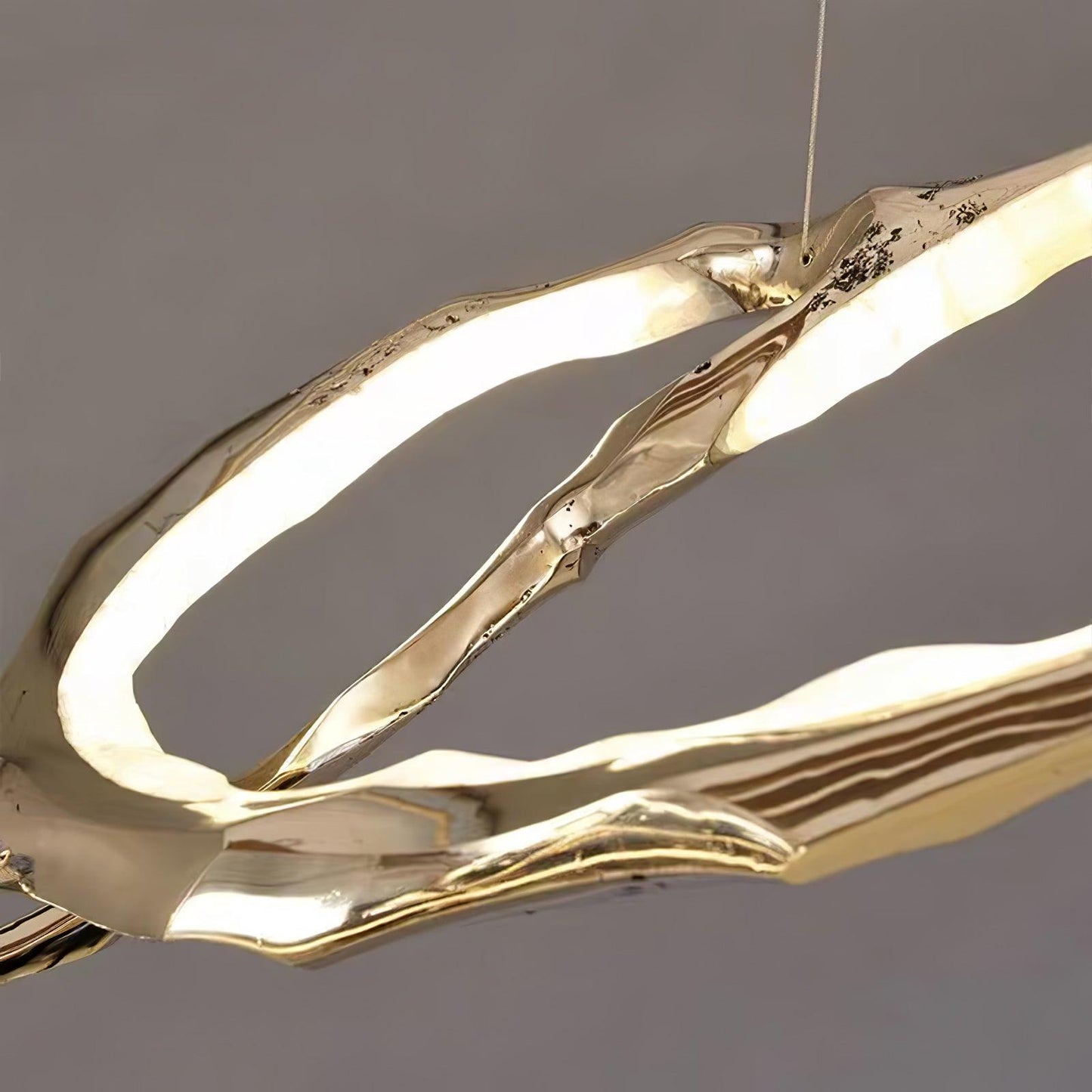 Elegant Brass Chandelier with Adjustable Arms and Ambient Lighting