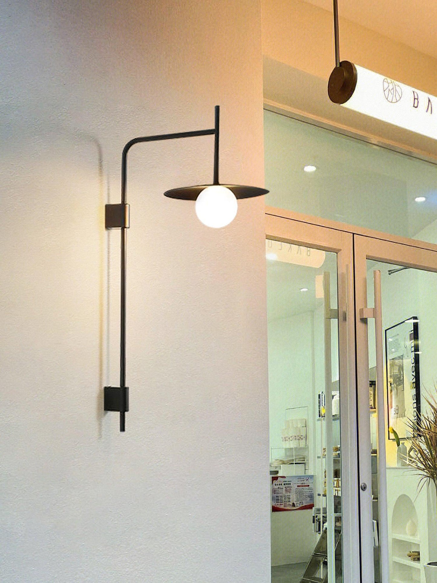 Gea Swing Arm Wall Lamp - Adjustable Light & Plug-in Design