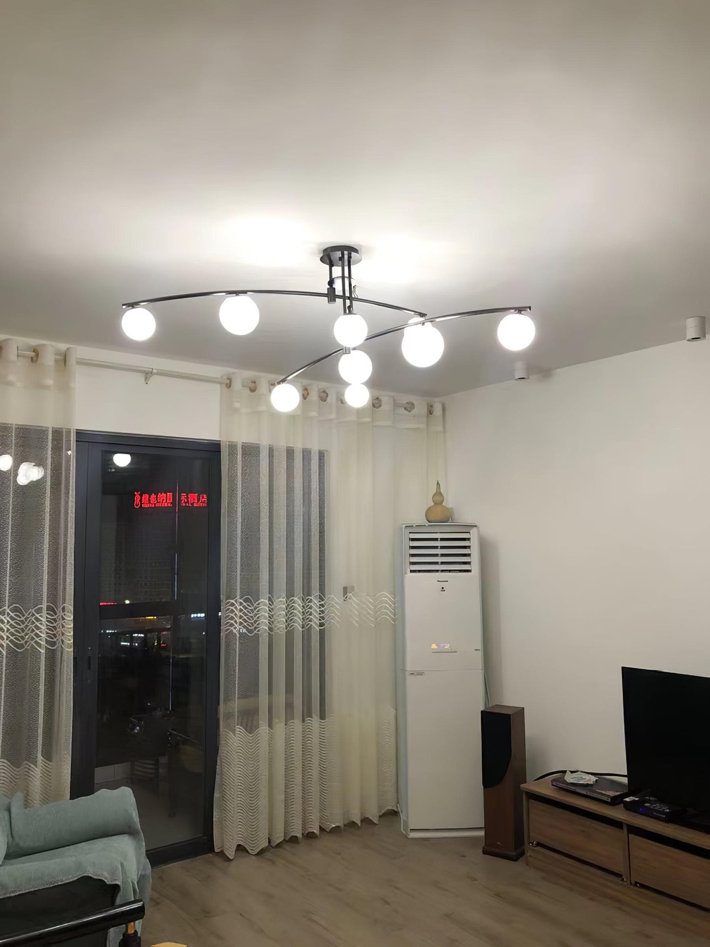 Elegant Long Arm Chandelier with Adjustable Arms and Dimmable Lighting