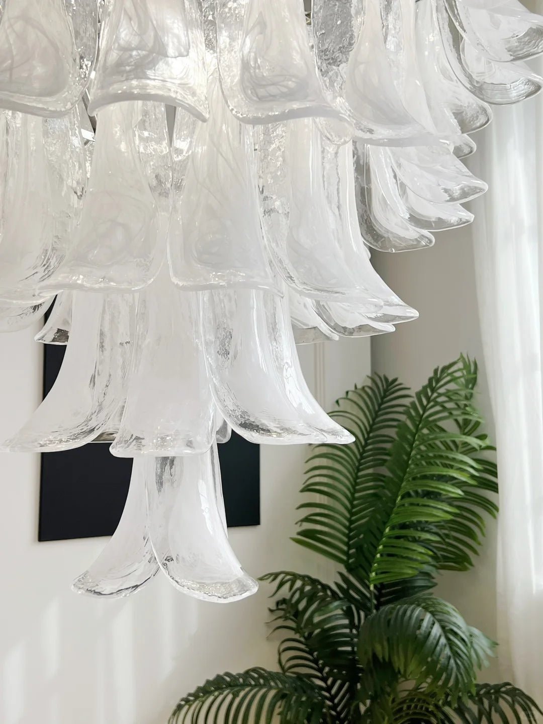 Elegant White Glass Petals Chandelier with Adjustable Height & Soft Il