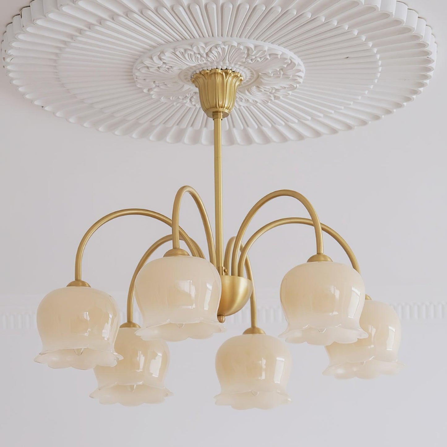 Elegant Brass Chandelier with Adjustable Arms and Crystal Accents