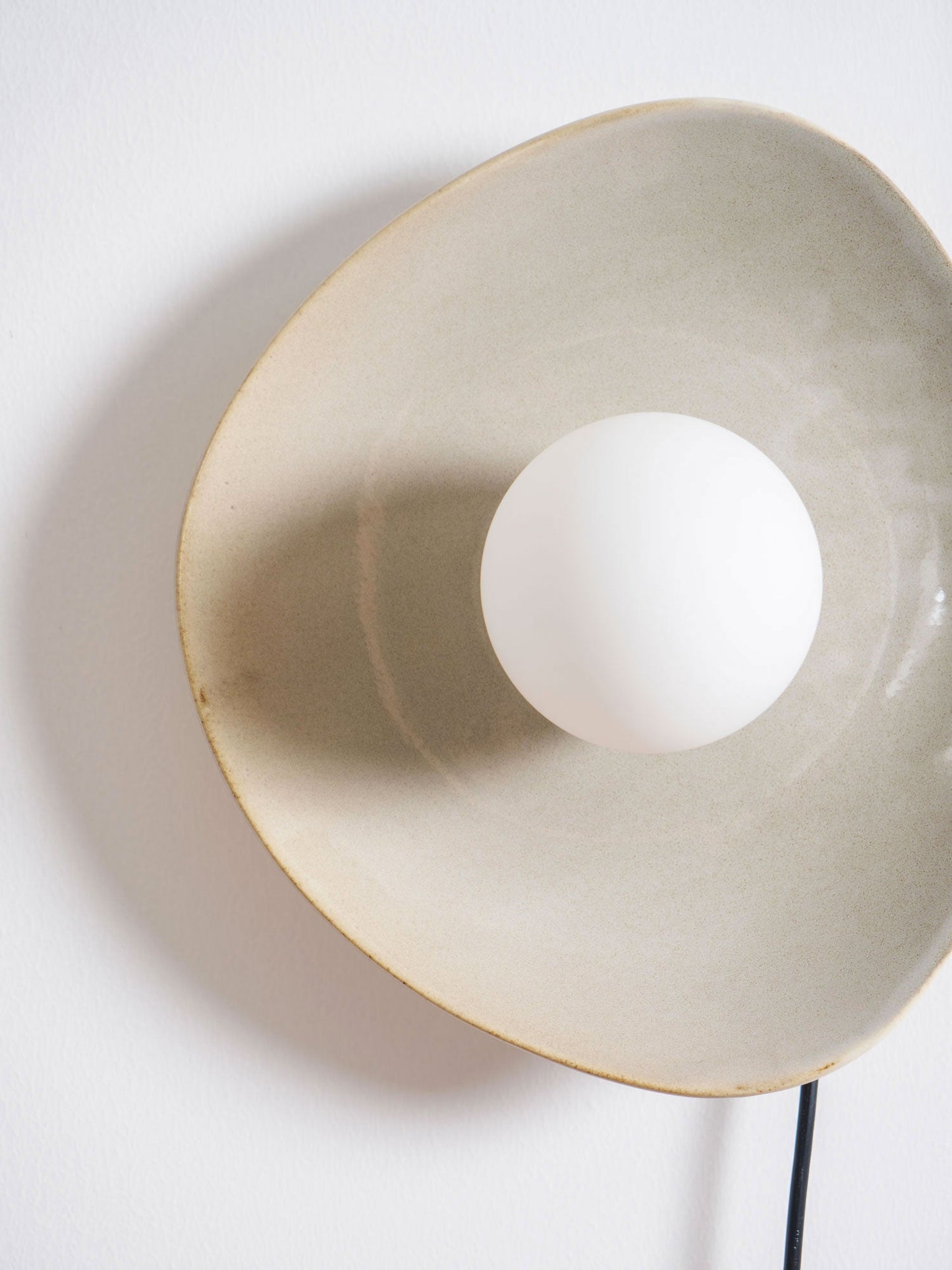 Pebble Disc Plug-in Wall Light with Adjustable Brightness & Energy Eff