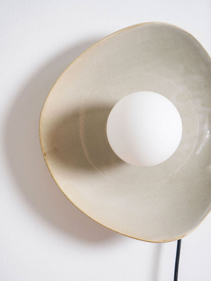 Pebble Disc Plug-in Wall Light with Adjustable Brightness & Energy Eff