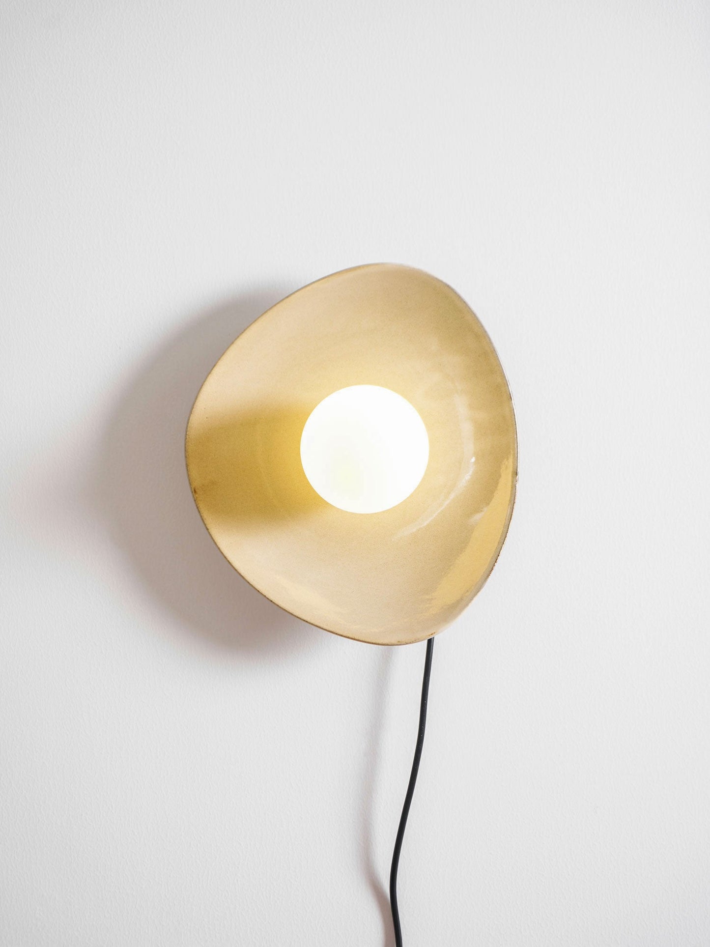 Pebble Disc Plug-in Wall Light with Adjustable Brightness & Energy Eff