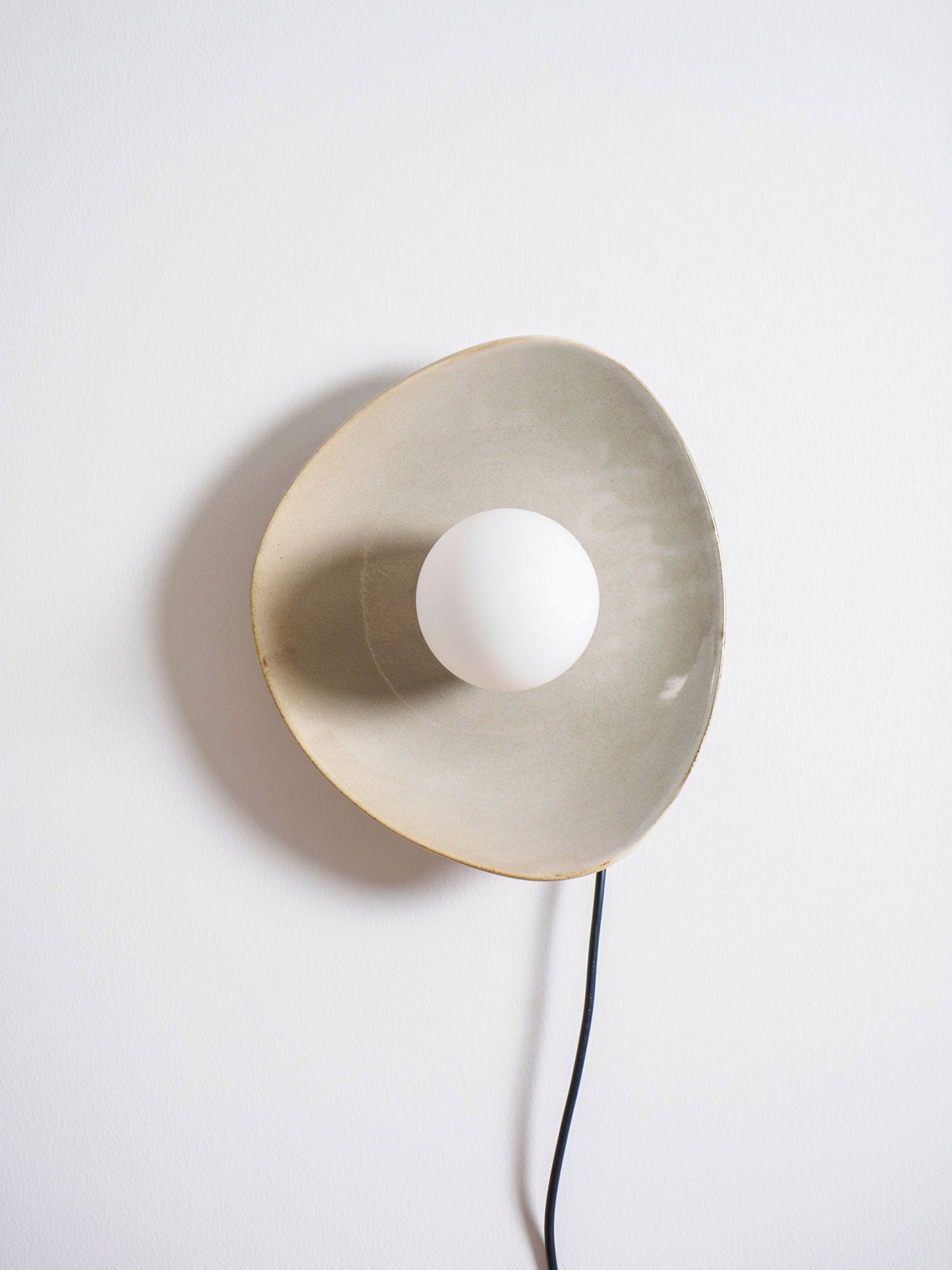 Pebble Disc Plug-in Wall Light with Adjustable Brightness & Energy Eff