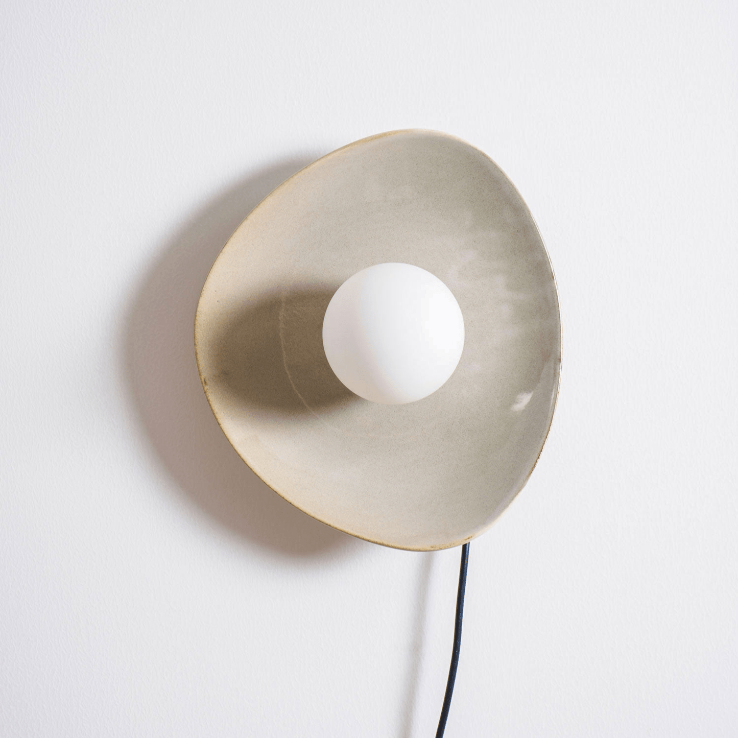 Pebble Disc Plug-in Wall Light with Adjustable Brightness & Energy Eff
