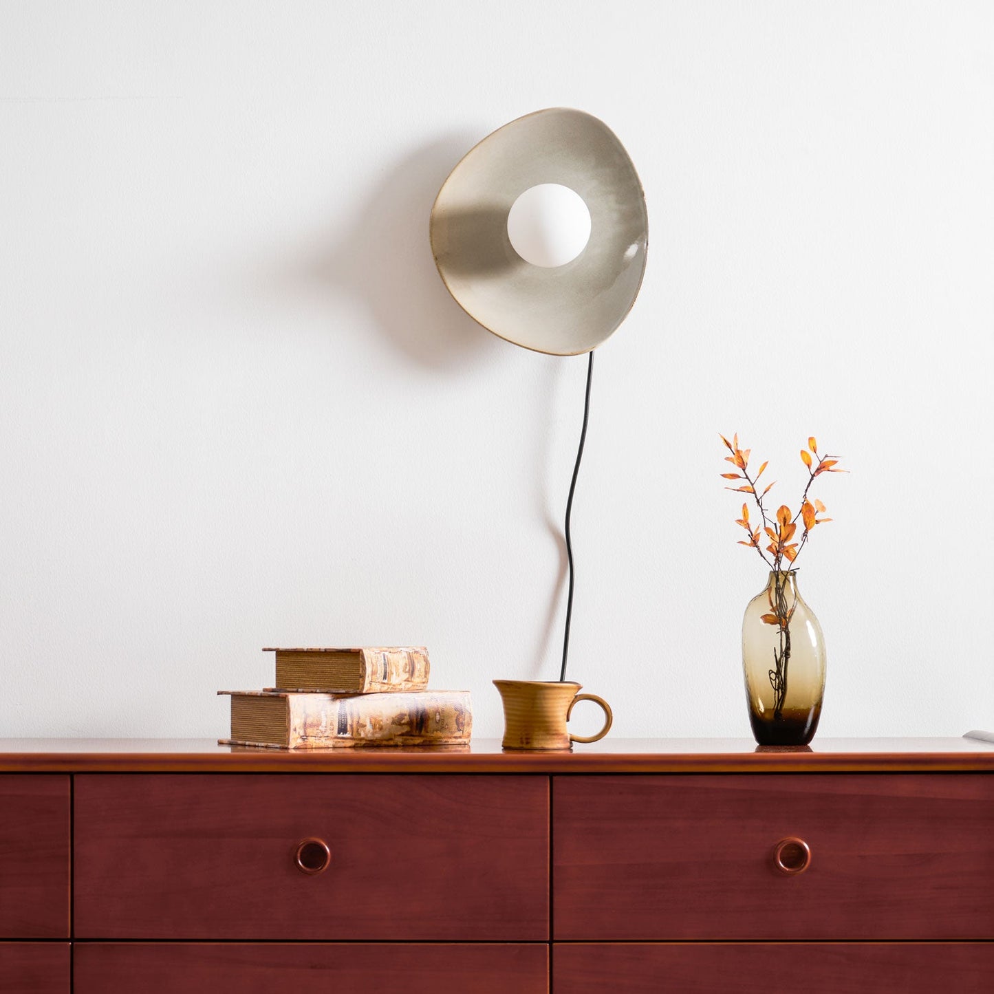 Pebble Disc Plug-in Wall Light with Adjustable Brightness & Energy Eff
