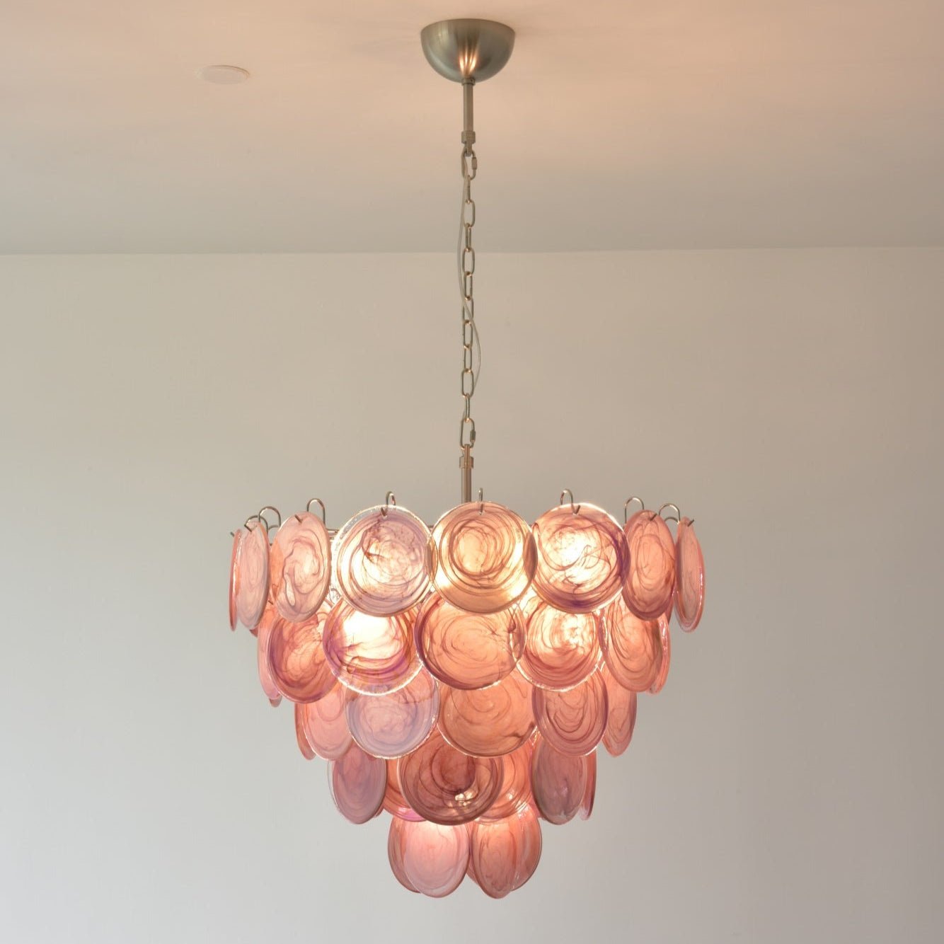 Elegant Pink Glass Disc Chandelier with Adjustable Height & Soft Light