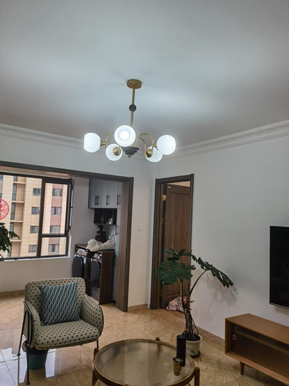 Modern Sculptural Ribbed Glass Chandelier with Adjustable Lighting